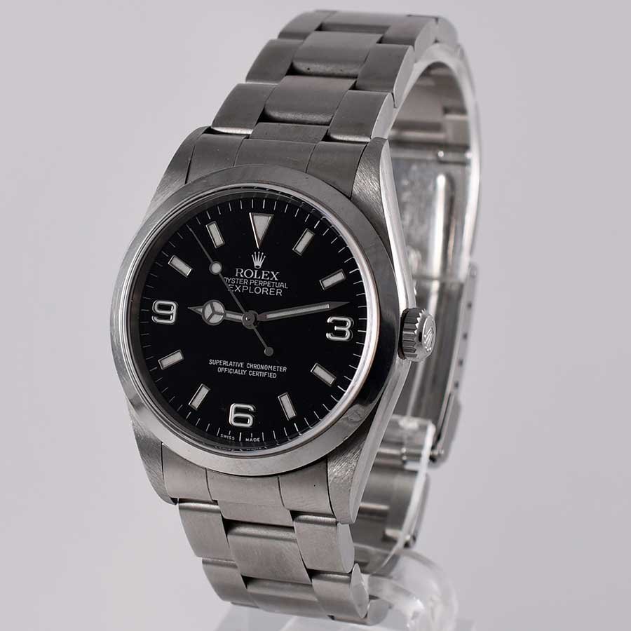 Close-up of a stainless-steel Rolex Oyster Perpetual Explorer with a black dial, 3-6-9 numerals, Mercedes hands and an Oyster bracelet.