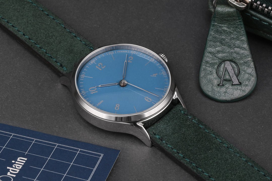 anOrdain Model 1 Hebridean Blue enamel dial watch styled with props